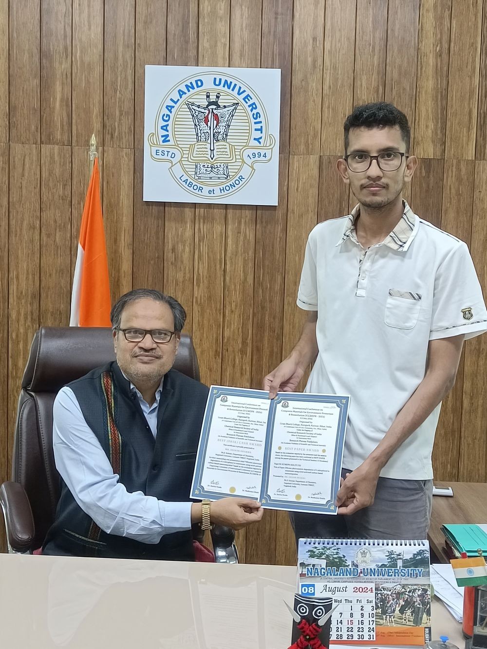 Prof JK Patnaik, VC, NU hands over the certificates to Shisak Sharma.